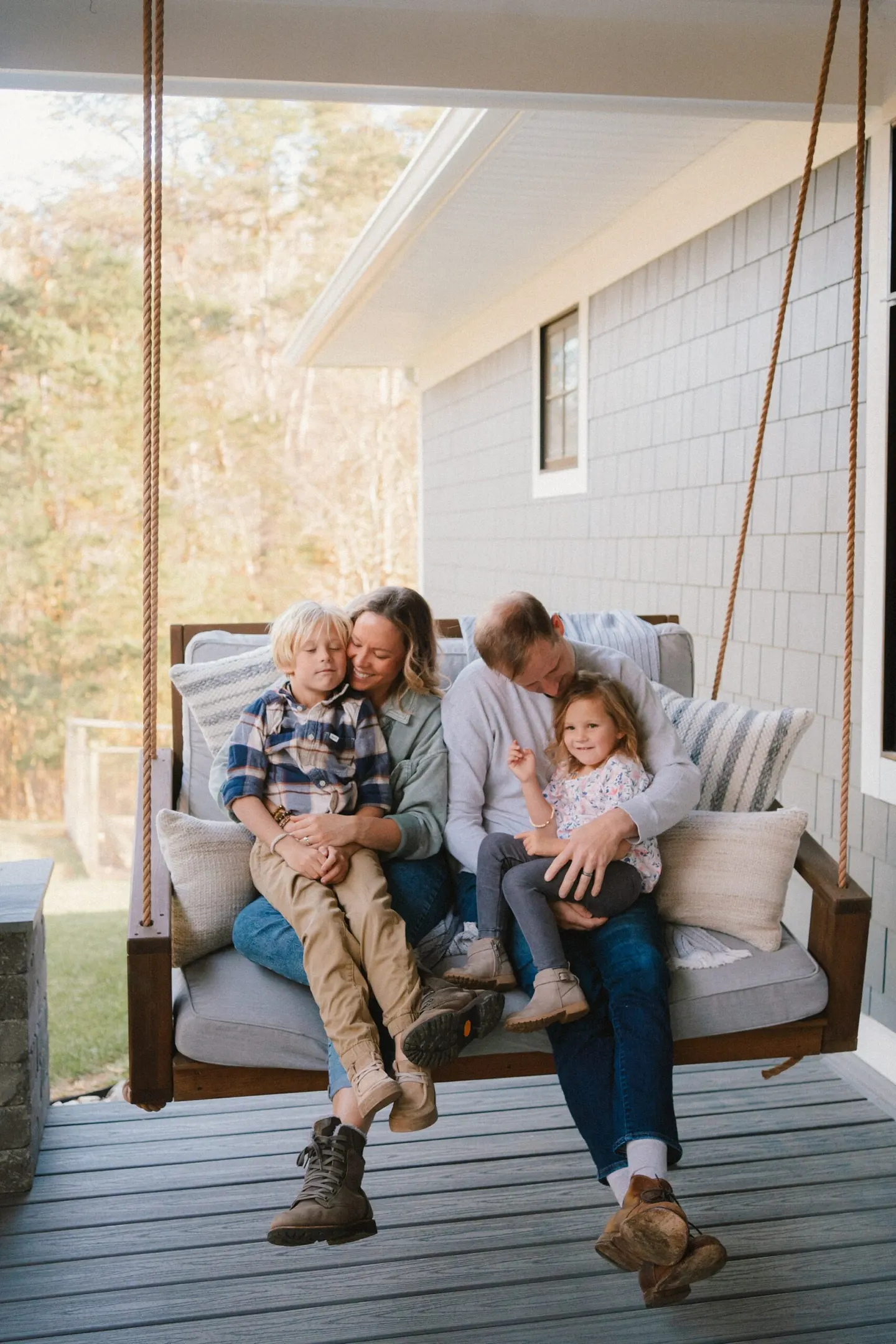 fall family photos in Charlottesville on the backyard porch swing