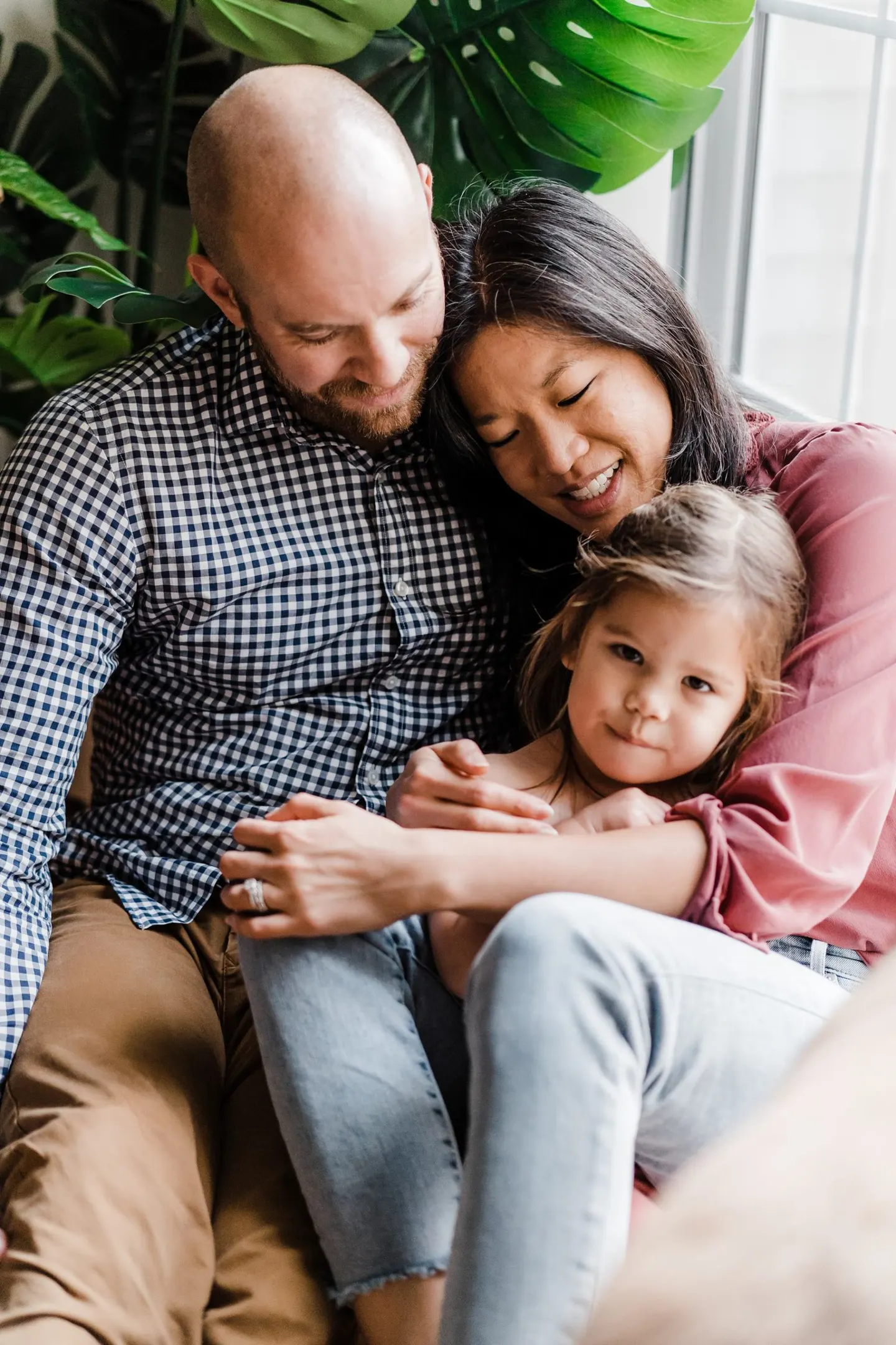 pose for family of three at home in lifestyle family photos by charlottesville va photographer