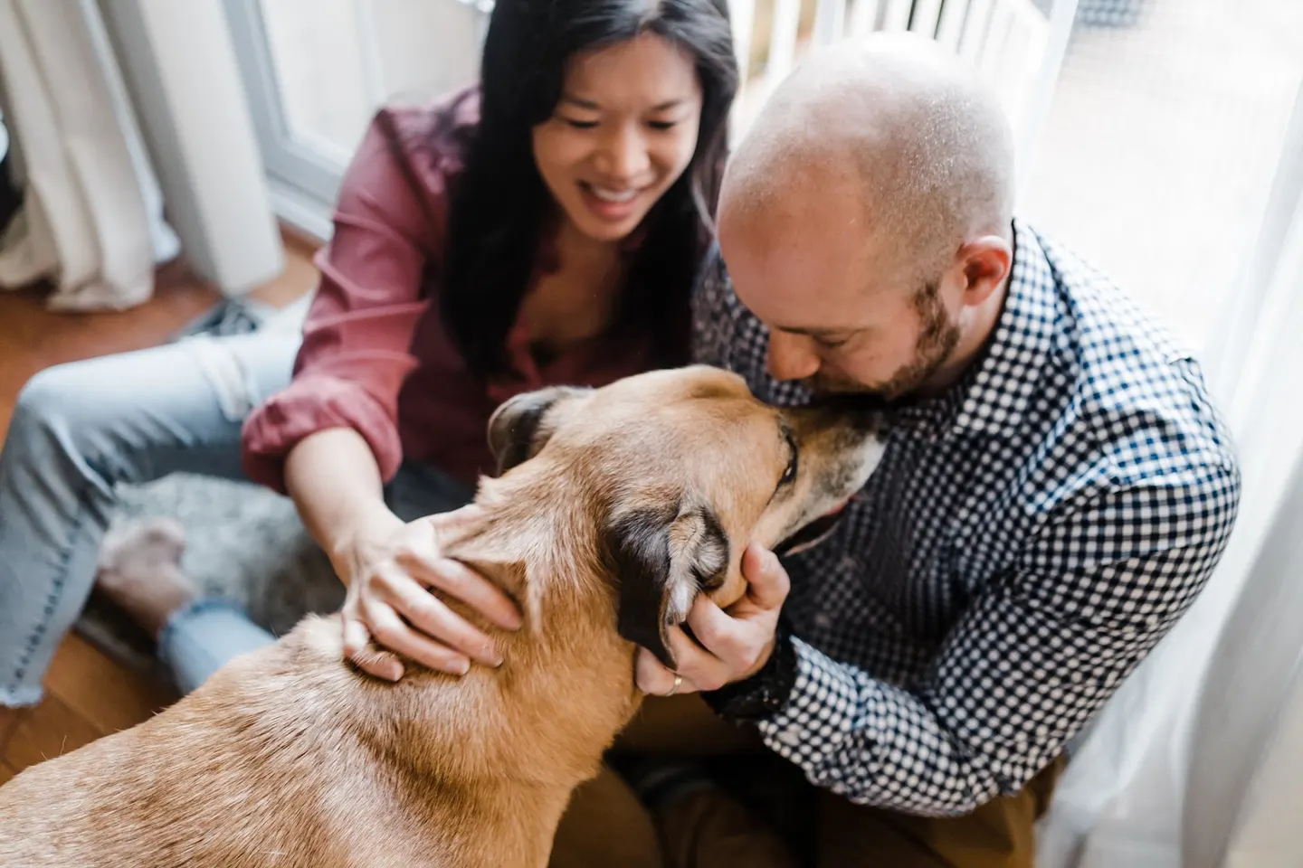 lifestyle family photos at home with a dog