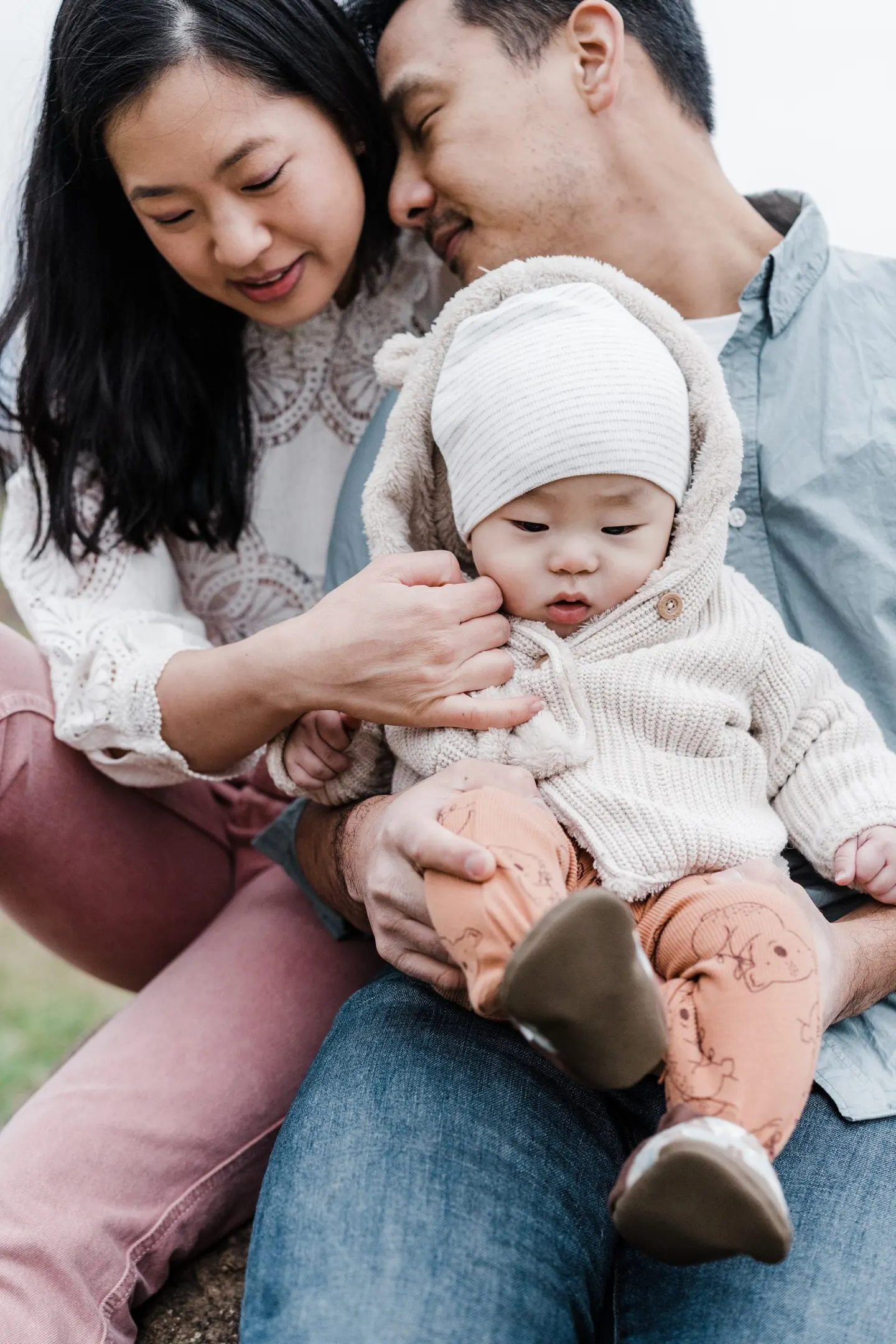 poses for family photos with 6 month old baby