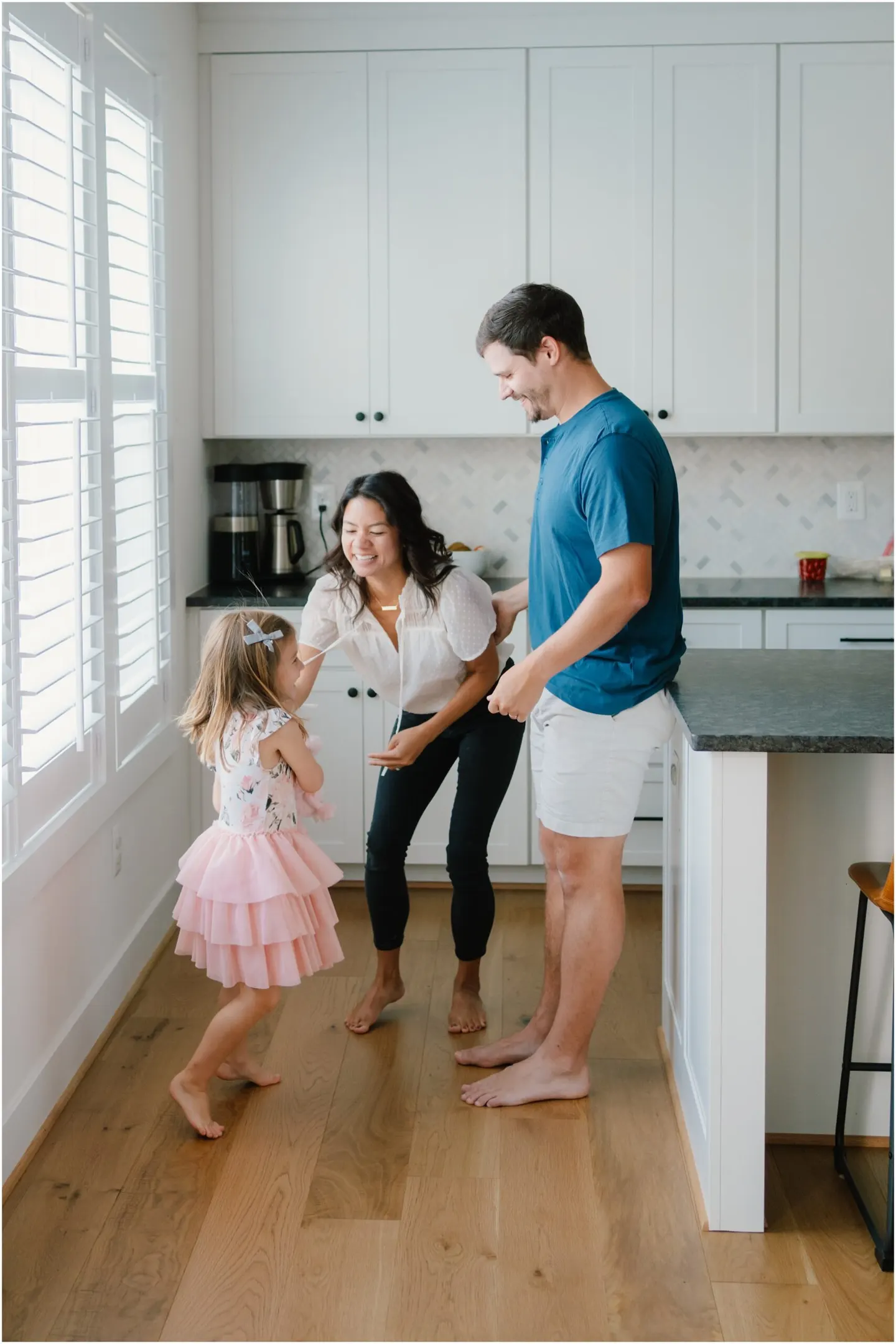 playful family photos at home in the kitchen