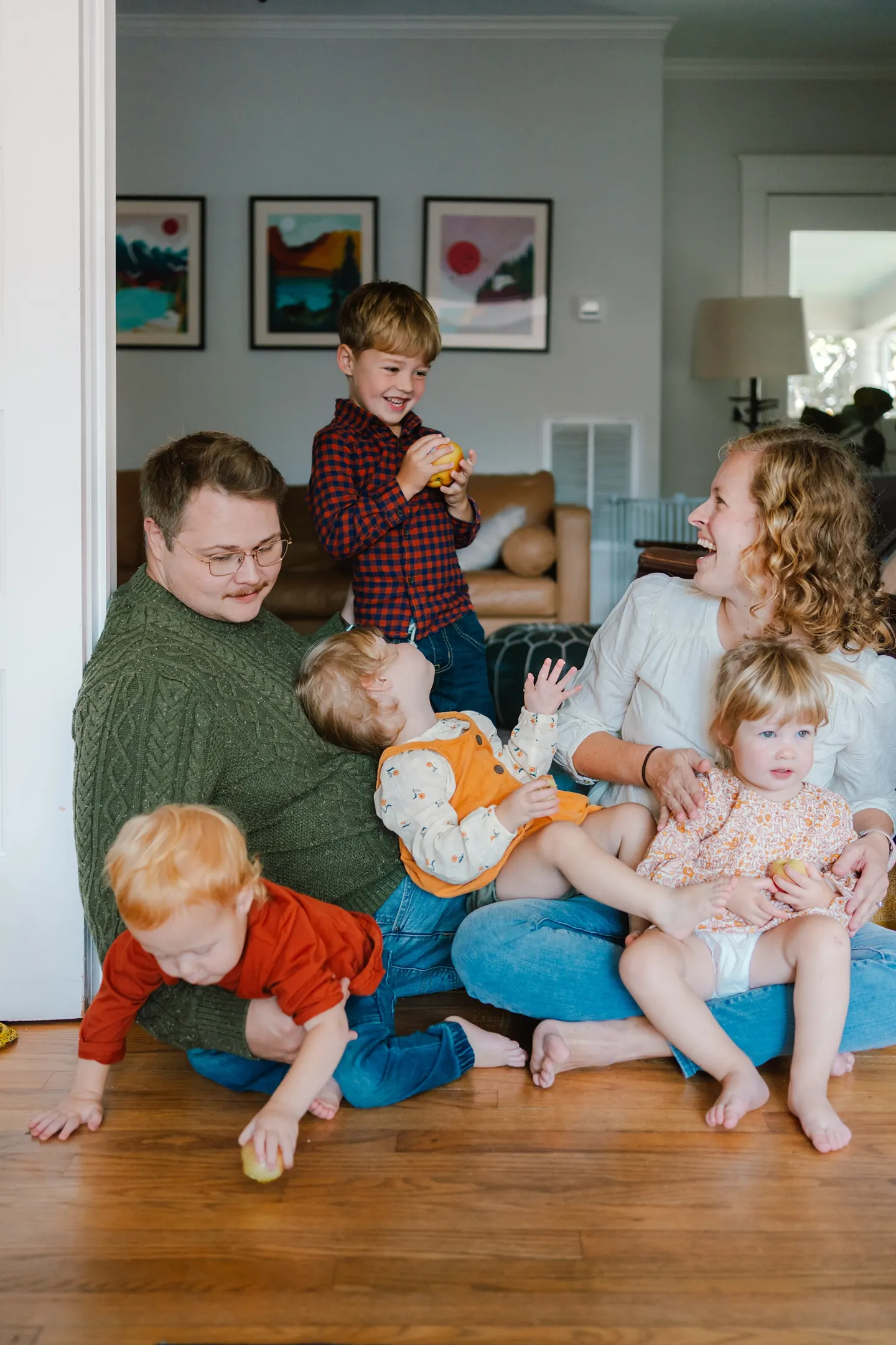 poses for a family of six with young kids