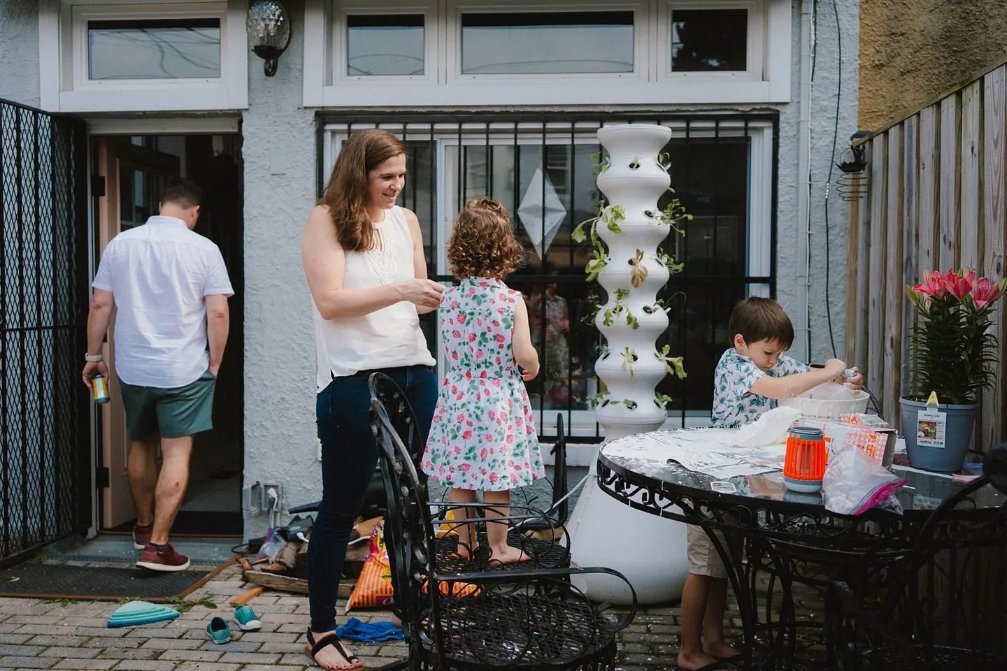 messy family photos in the backyard making oobleck