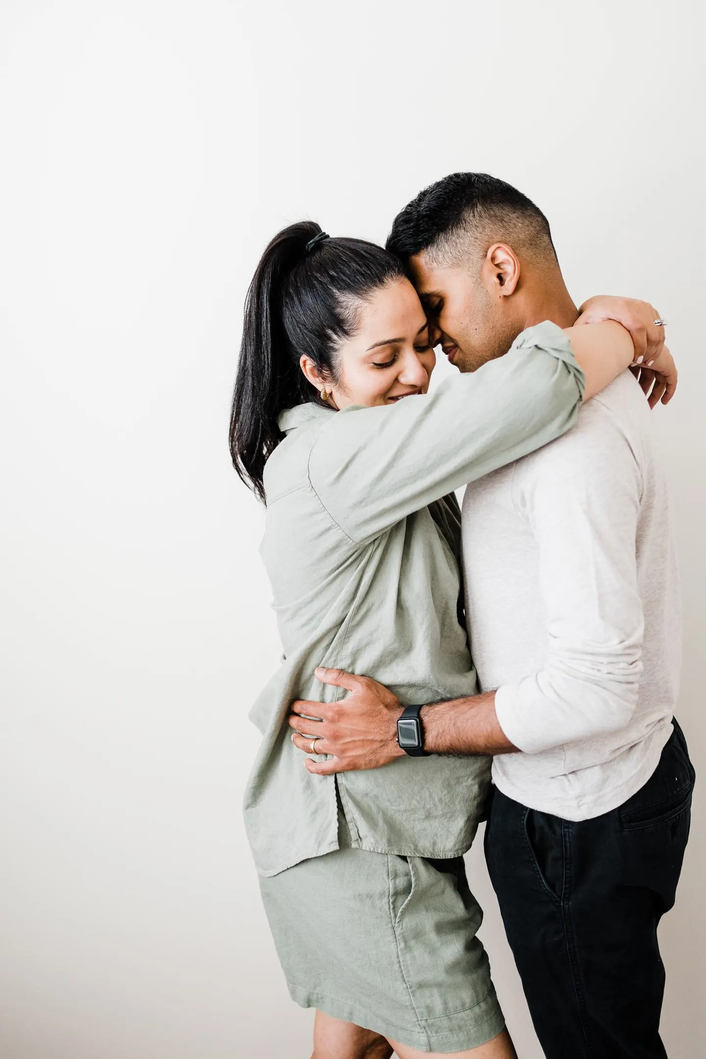 pregnant mom hugging husband - at home maternity photos in charlottesville va